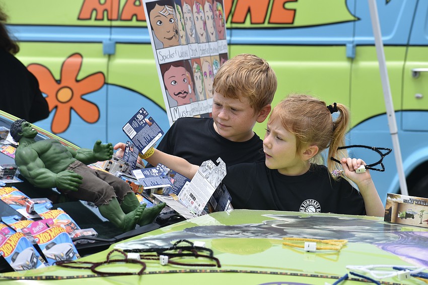 Hudson Garten, 9 and Ava Garten, 6, check out the items atop the Hulk Smash Hot Wheels car.