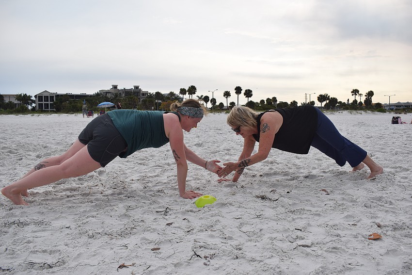 Jamie McDermott-Galles and Jill Gilfillan Bower encouraged each other while doing 