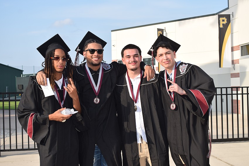 Braden River High's Derek Anders, Yahir Gonzalez, Alexander Caballero and Donovan Agelvis are ready to receive their diplomas.