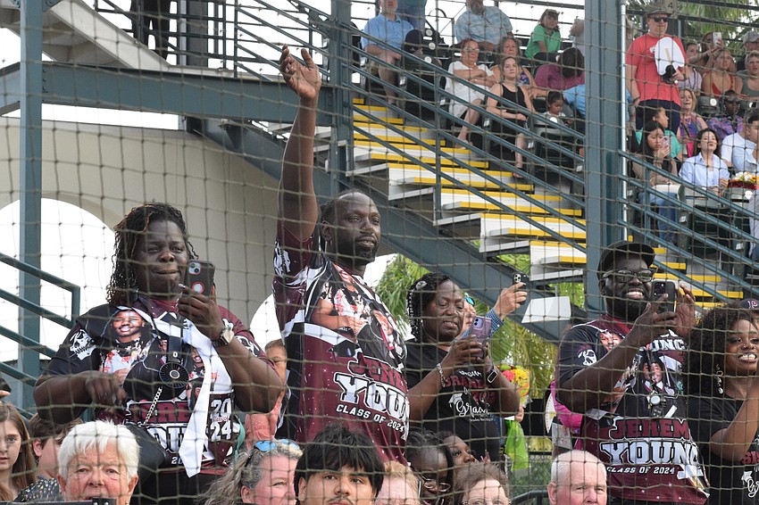 Braden River High graduate Jeremy Young's family made shirts to celebrate his graduation. They cheer for him as her enters the field at the beginning of the ceremony.