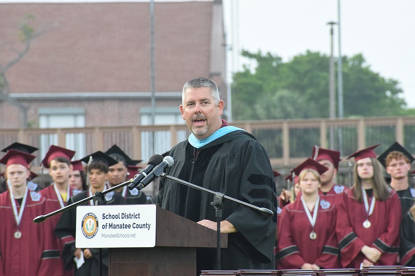 Carl Auckerman, the principal at Braden River High, welcomes family and friends to graduation.