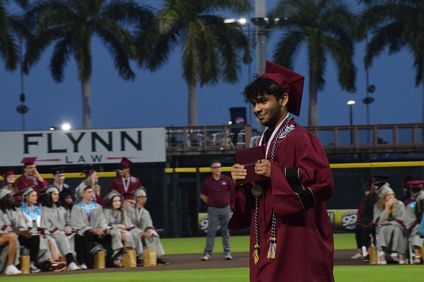 Braden River High graduate Ezekiel Lopez shows off his diploma.