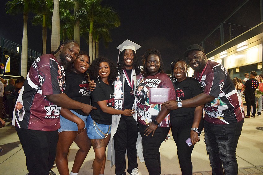 Dudley Octavien, Alexandra Jean-Baptiste, Tianna Jean-Baptiste, Braden River High graduate Jeremy Young, Merklene Octavien, Mimose Etienne and Danny Octavien celebrate Young's graduation. He was in the top 10% of his class.