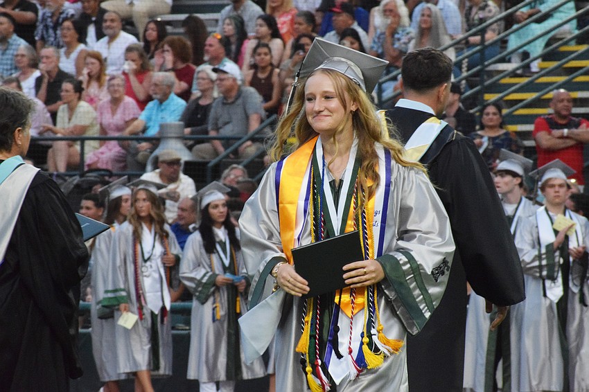 Tess Lippincott, a Lakewood Ranch High School graduate, beams with pride after receiving her diploma.