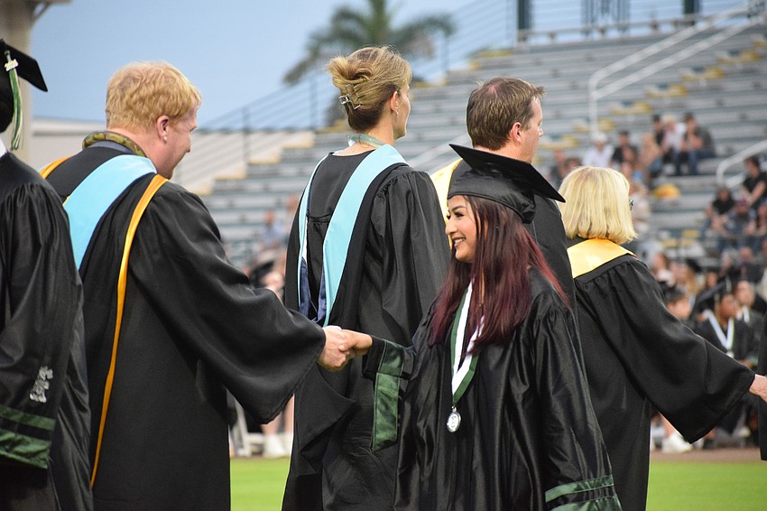 Jason Wysong, the superintendent of the School District of Manatee County, congratulates Cristal Aguillon, a Lakewood Ranch High School graduate.