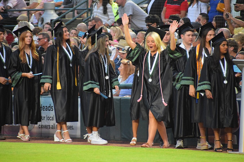 Kaley Edwards, a Lakewood Ranch High School graduate, busts a move on her way to receiving her diploma.