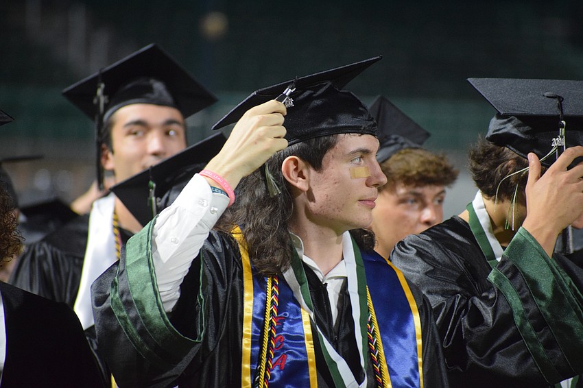 Samuel Barr, a Lakewood Ranch High School, moves his tassel signifying his graduation.