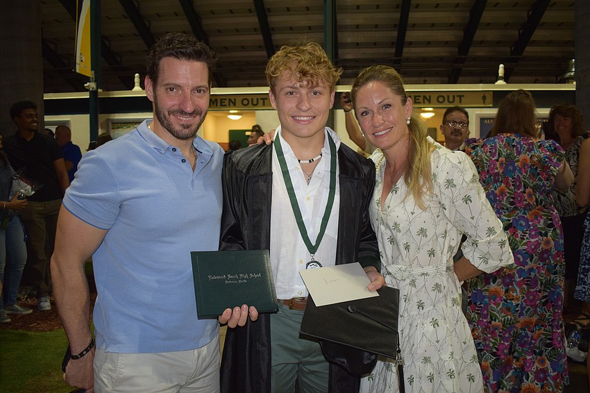 Jason Fisher, Evan Fisher and Sophie Fisher celebrate the graduation of Evan Fisher from Lakewood Ranch High School.