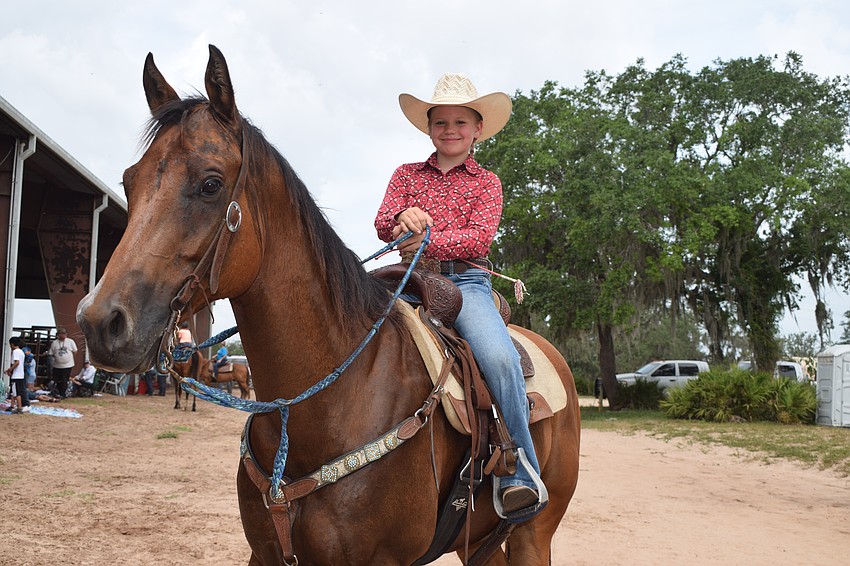 Fourth grader Macie Connours beams with pride as she's able to participate in the rodeo after achieving her goals in reading, math, behavior and attendance.