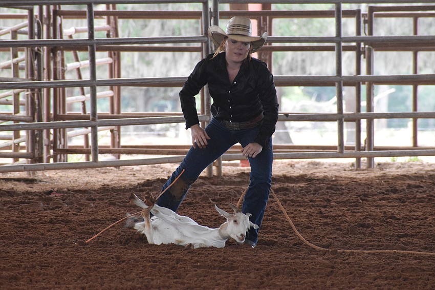 Dakota Watson is first up in the goat-tying competition.