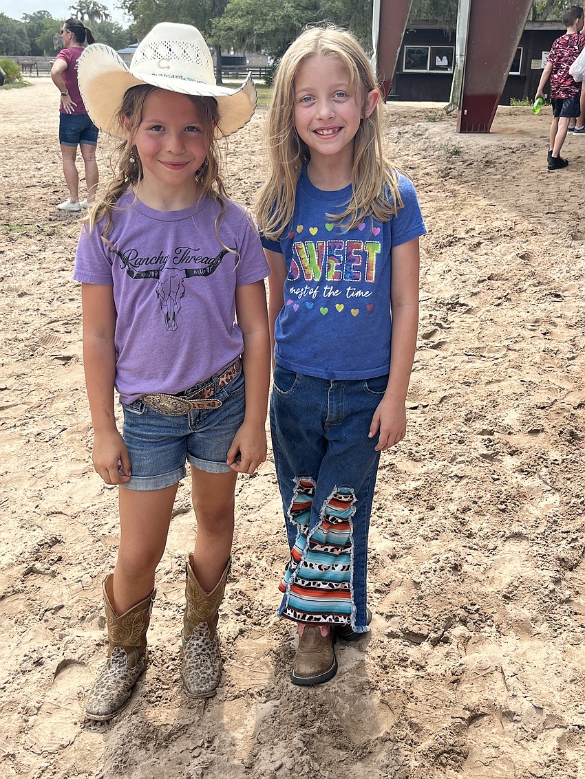 First graders Kaylie Connours and Dakota Bryant have fun at the rodeo. In order to attend or participate in the rodeo, students had to achieve three of their four quarterly academic goals.