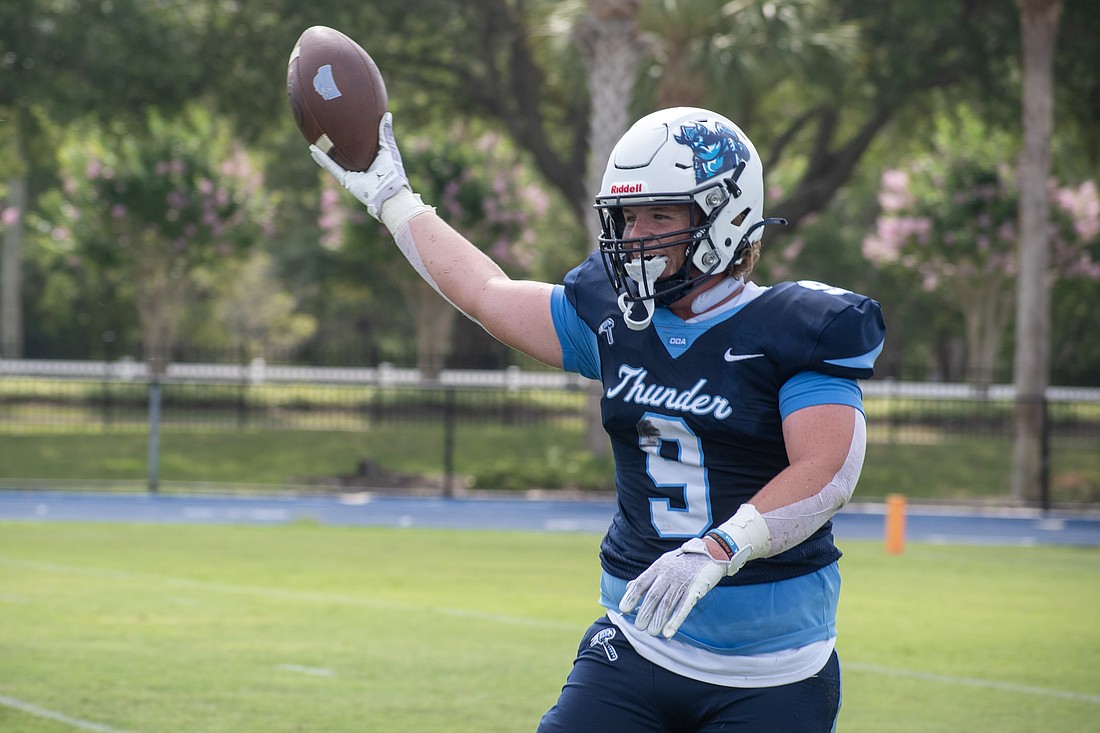 ODA linebacker Heath DeRusso holds the football aloft after recovering a fumble against Sarasota Christian in the team's spring game. DeRusso said the team is feeling no extra pressure after winning a SSAA Class 4A title last season.