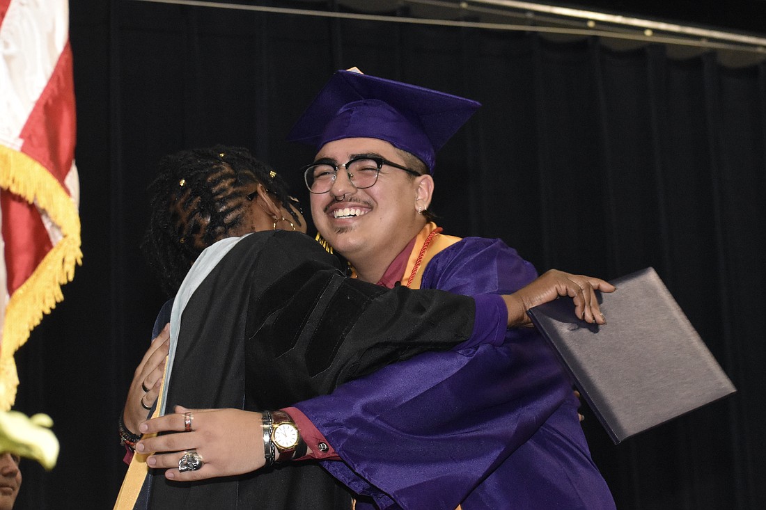 Principal Rachel Shelley greets Maximiliano Lopez Zapata
