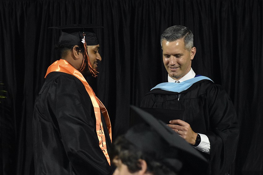 Ohm Patel greets Superintendent Terry Connor