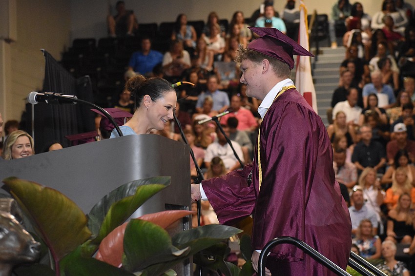 Principal Erin Haughey greets John Horne.