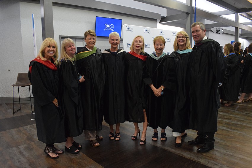 The Out-of-Door Academy faculty and staff Virgene Linse, Patty Young, Shelley Stone, Renee Pitts, Kathy Dozier, Martha Gulacsy, Jeff Horr and Linda Vasilaki look forward to seeing students they've worked with graduate.