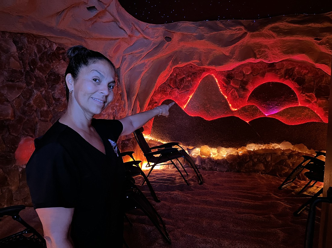 Myra Maldonado shows the inside of one of the salt caves. The salt came from Pakistan, and the cave was designed to transport people to a calm, relaxing "safe haven," she says.