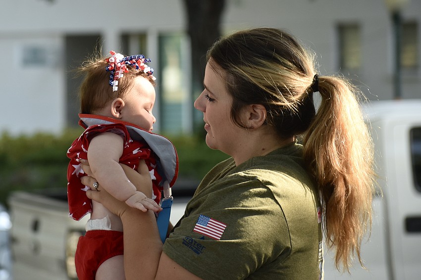 Four-month-old Noa Miller gets ready to depart with her mother Marlee Miller