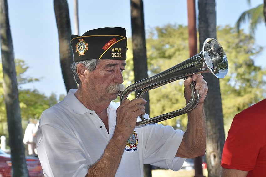 Gary Williams of VFW Post 3233 plays Taps.