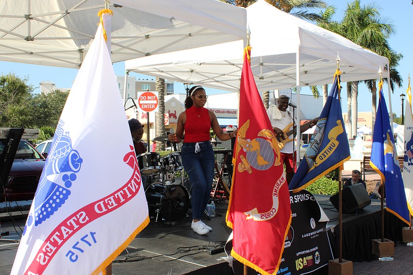 Singer Chantelle Campbell entertains the crowd before the Tribute to Heroes Parade.