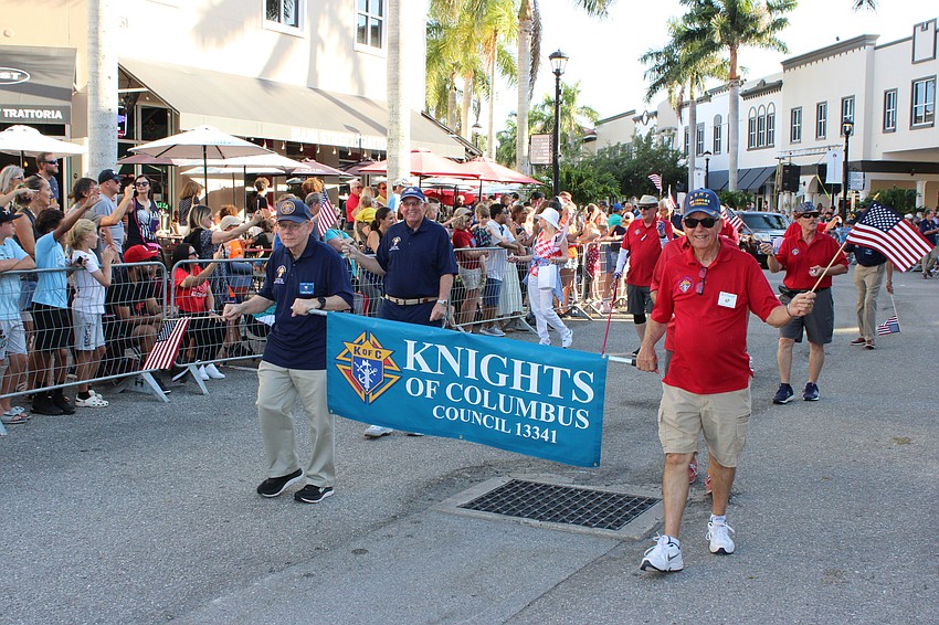 The Knights of Columbus make their way down Lakewood Main Street.