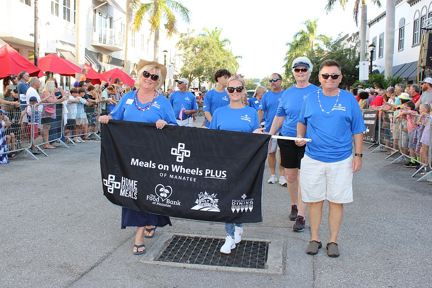 Meals on Wheels Plus Manatee marches in the Tribute to Heroes Parade.