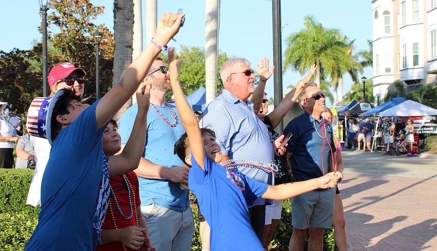 Beads were in the air at the Tribute to Heroes Parade and kids tried to collect as many as possible.