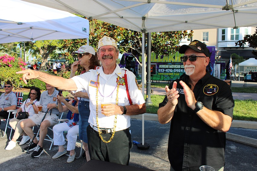 Graham Ellis and Dave Daily of VFW Braden River Post 12055 enjoy those marching in the Tribute to Heroes Parade.