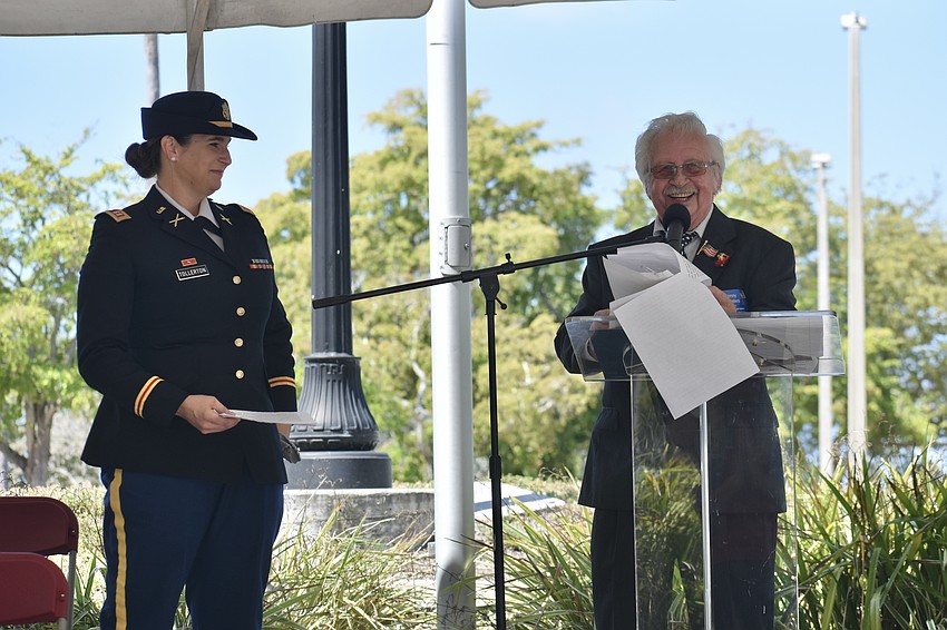 Sarasota native and Army veteran Michael Tollerton, the main speaker at the ceremony, is introduced by Marine veteran Sonny Bywaters.