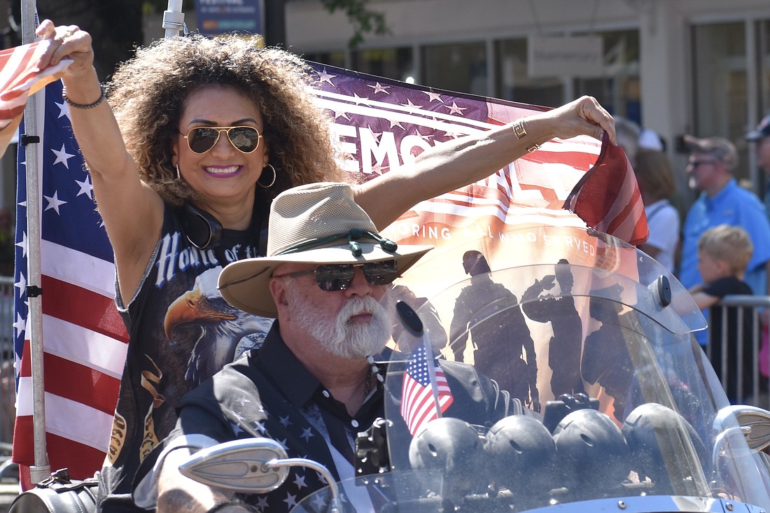 Liliana William and Miguel Gomez participate by motorcycle.