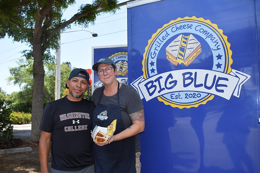 Jose Rios and Brenna Foster with the Big Blue Grilled Cheese Company food truck.