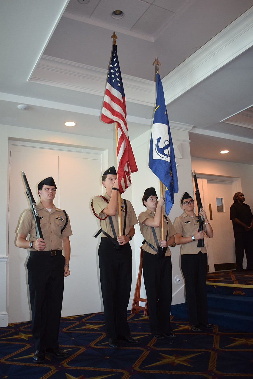Lemon Bay High School’s Junior Navy ROTC raises the colors in its flag ceremony for the Bird Key Yacht Memorial Day celebration.