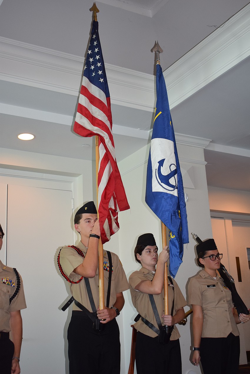 Lemon Bay High School’s Junior Navy ROTC raises the colors in its flag ceremony for the Bird Key Yacht Memorial Day celebration.