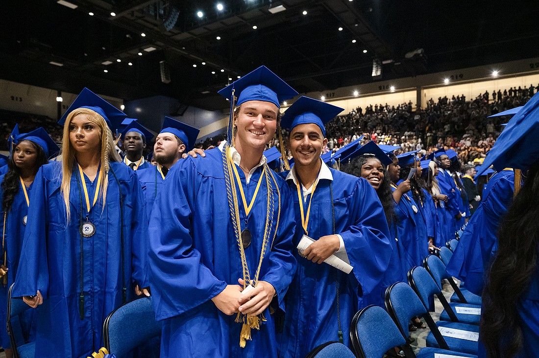 Mainland Buccaneers hang out before the commencement exercises begin at the Ocean Center. Photo by Michele Meyers