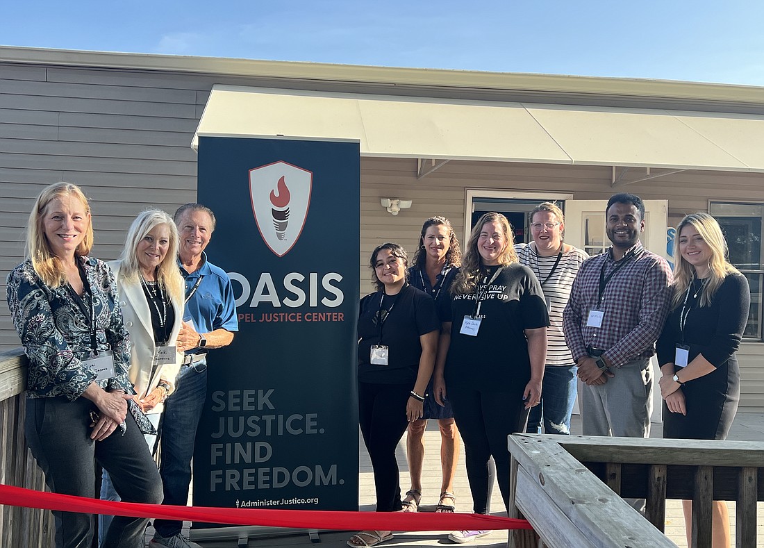 The Oasis Gospel Justice Center team celebrates the opening of the legal aid service at Oasis Church.