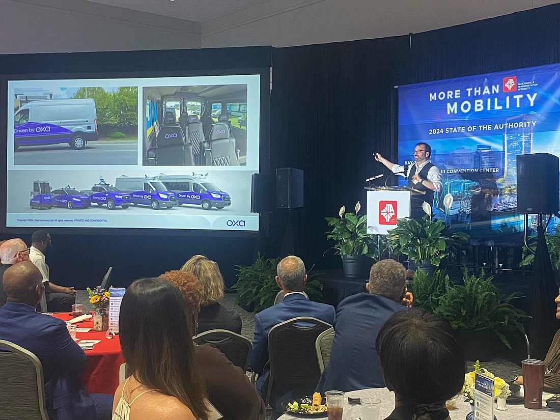 Oxford University professor Paul Newman, whose company, Oxa, makes the software for the Jacksonville Transportation Authority’s Ultimate Urban Circulator automated people movers, speaks at the JTA’s State of the Authority event at the Prime Osborn III Convention Center on May 30.