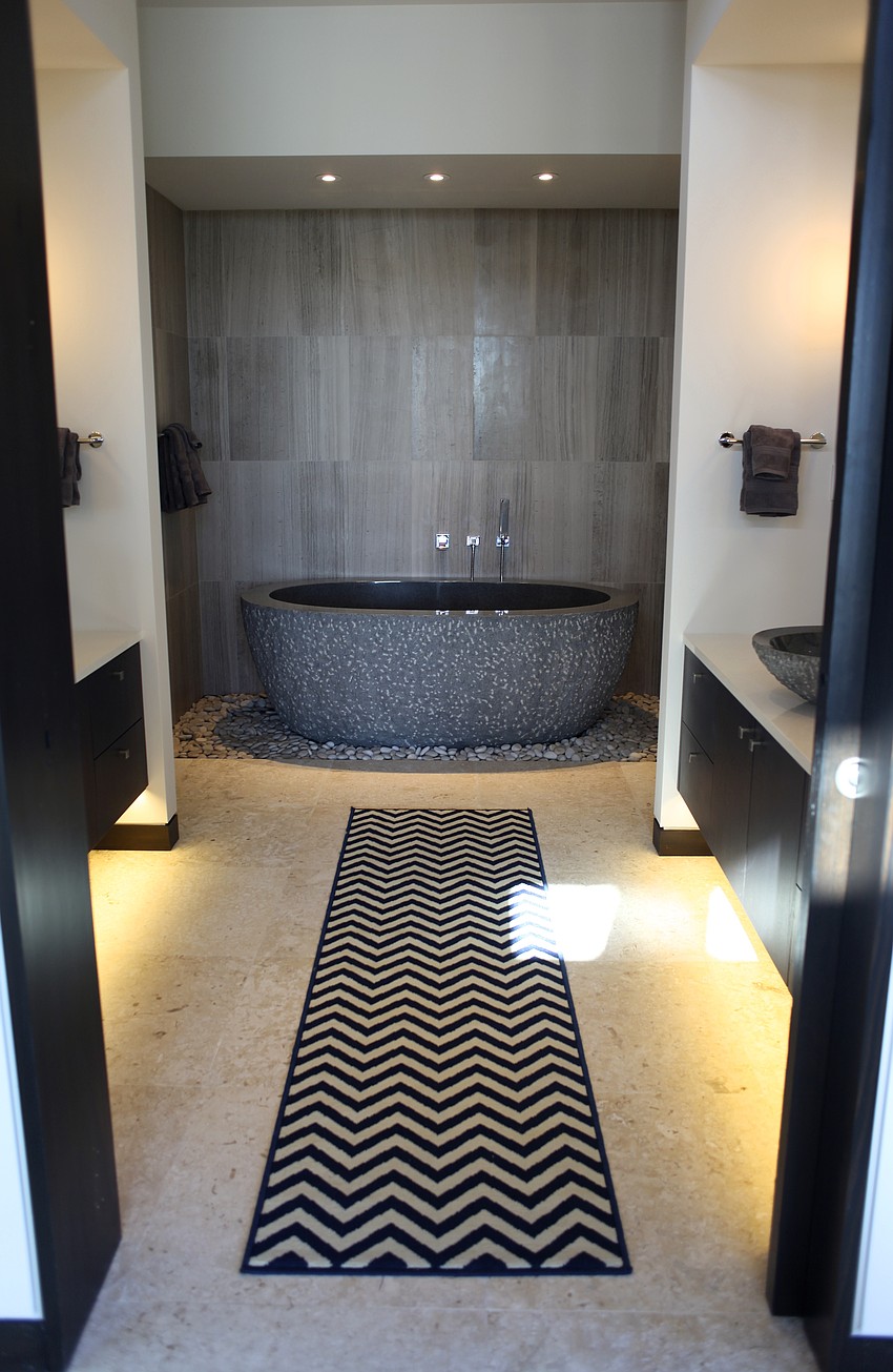 The bathtub is central to the guest bathroom.