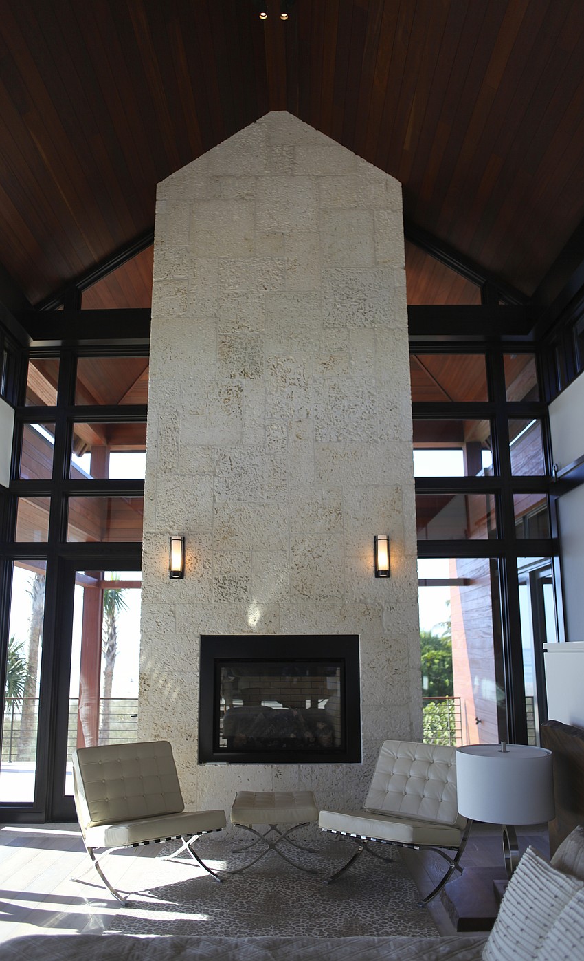 Tall ceilings and a fireplace in Ohana's master bedroom.