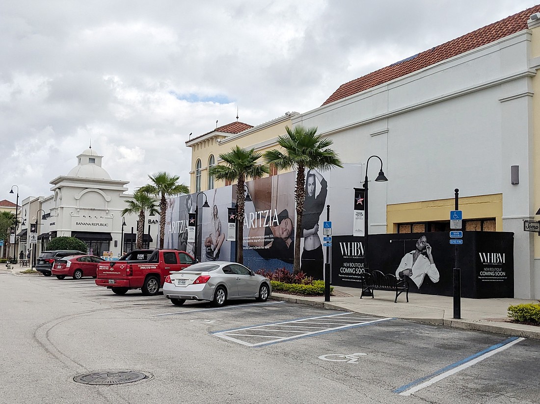 Construction walls are up all over St. Johns Town Center. Aritzia is building out in the former J. Crew and Loft spaces. WHBM is also building-out next door.