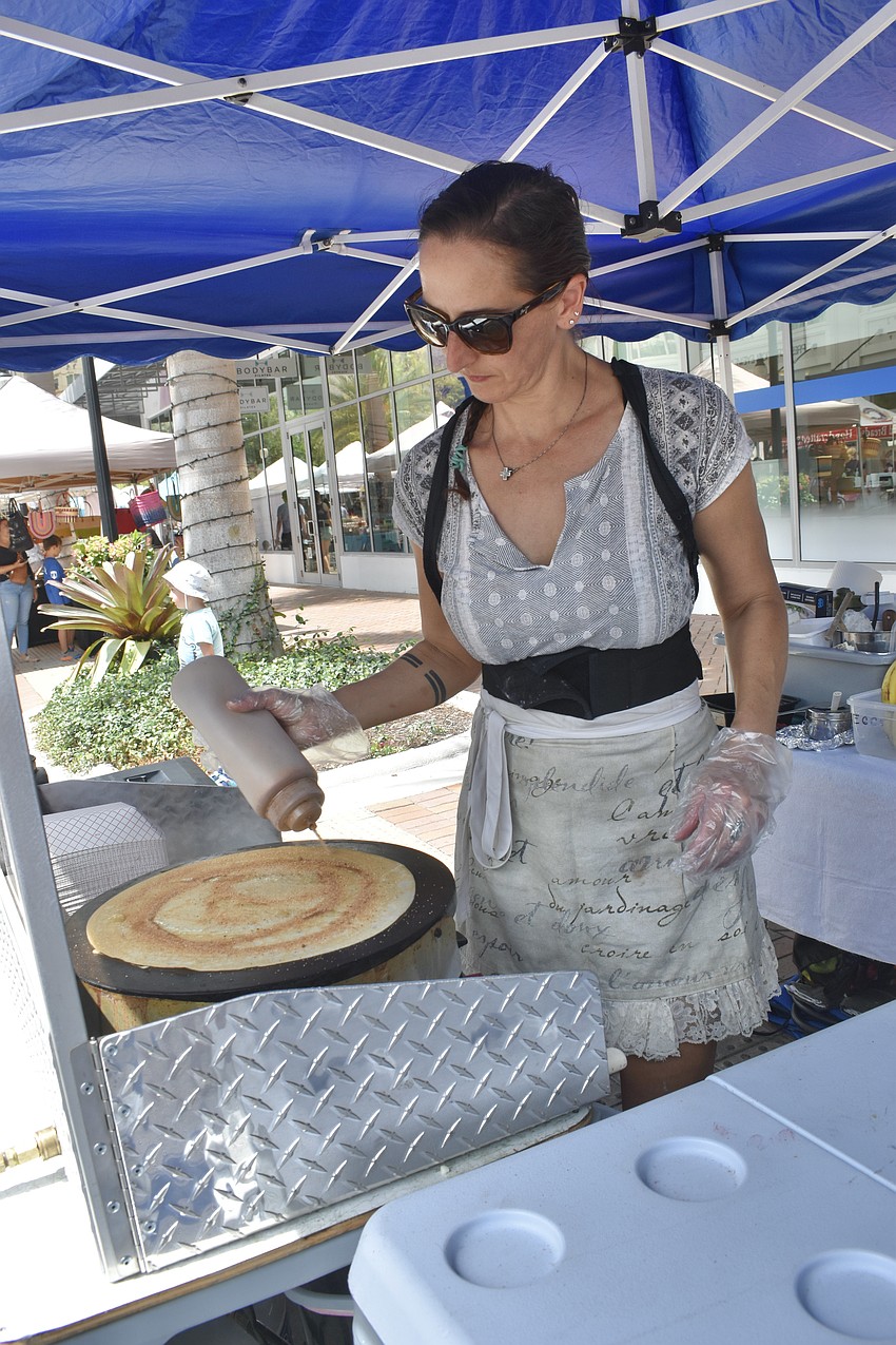 Natalia Winn of Traditional French Crepes cooks up a crepe for a customer.