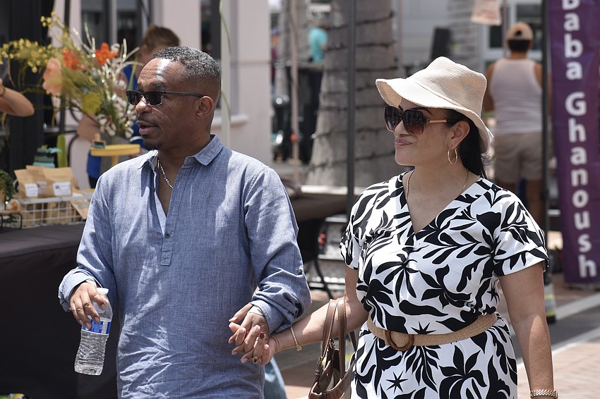Bennett and Ruth McAllister take in the atmosphere of the Farmer's Market.
