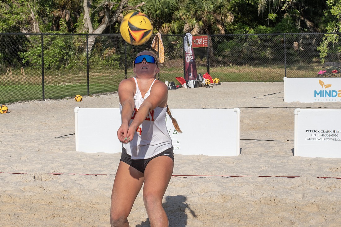 Cardinal Mooney's Izzy Russell plays both beach and indoor volleyball for the Cougars.