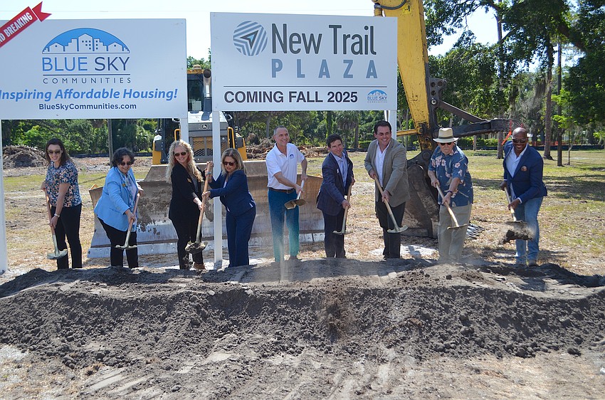 City officials and leaders of CASL and Blue Sky Communities flip ceremonial dirt at the groundbreaking of New Trail Plaza on North Tamiami Trail.