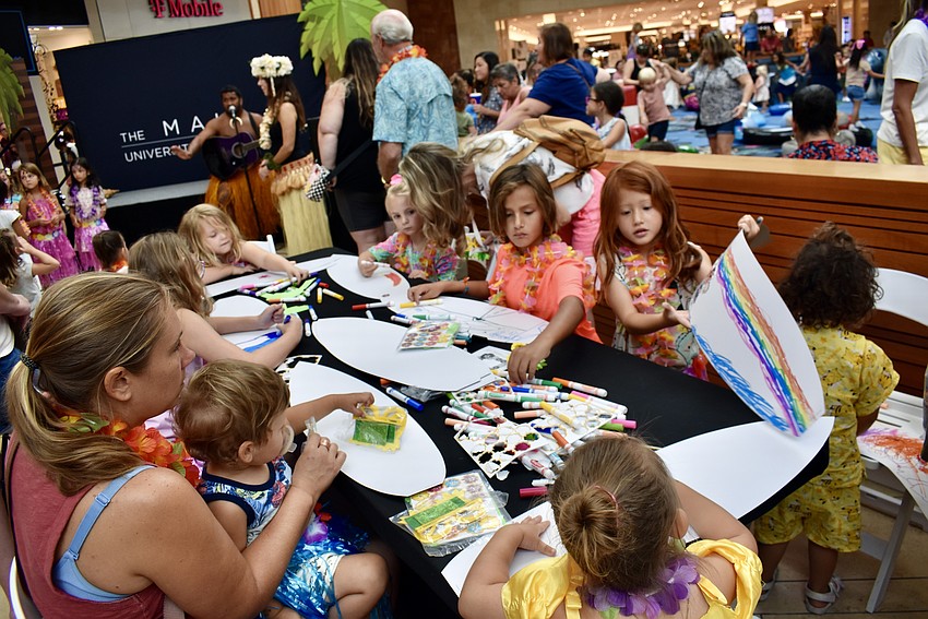 In addition to hula dancing, the kids decorate paper surf boards.