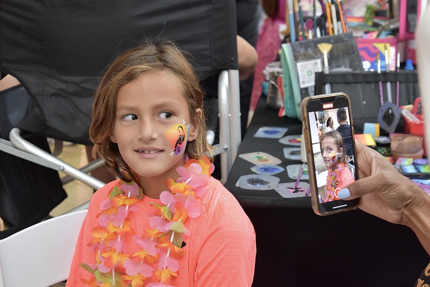 Sarasota resident Hunter Klimovitsch shows off his face painting.