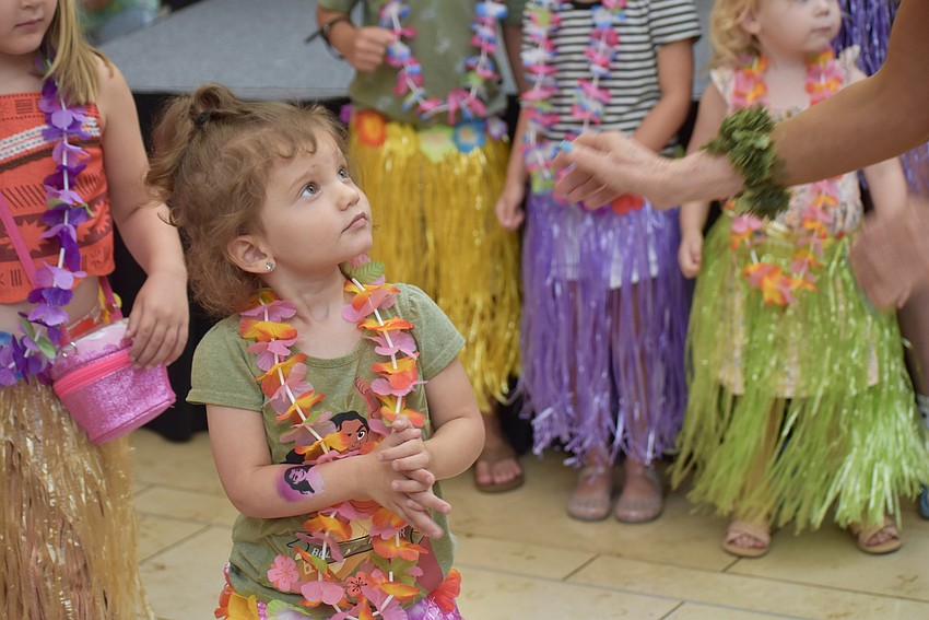 Palmetto resident and 3-year-old Alora Stone learns to hula dance.