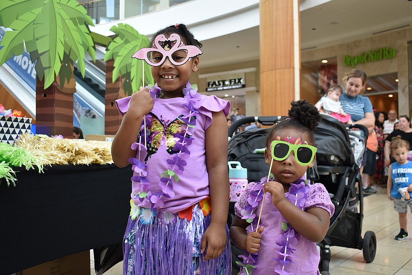 Sarasota residents Mariah Underwood, 7, and Marisa Underwood, 2, wait on line to meet Moana and Te Fiti.