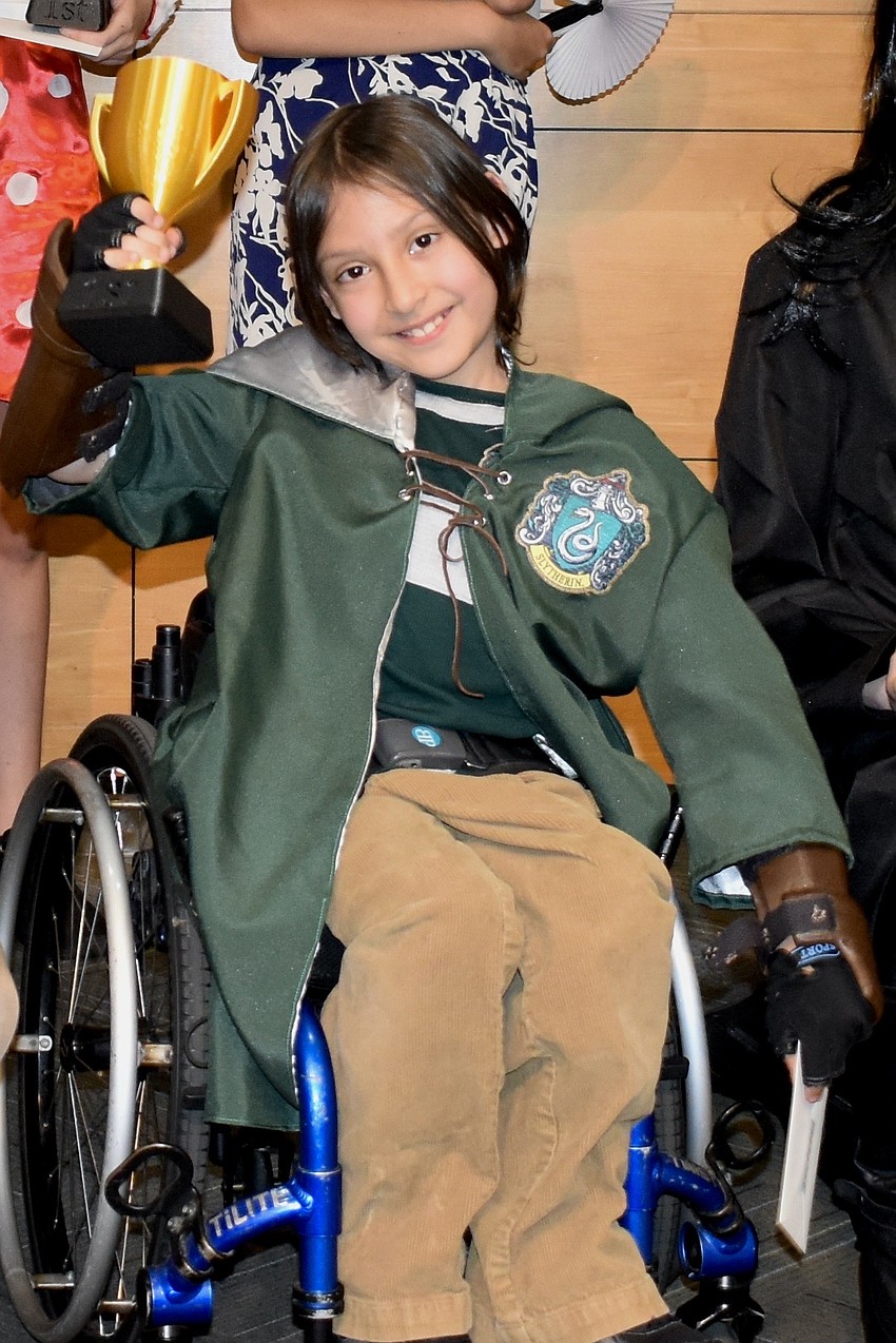 Damon Garcia, 9, won first place in the children's costume contest for his costume of a Slytherin.