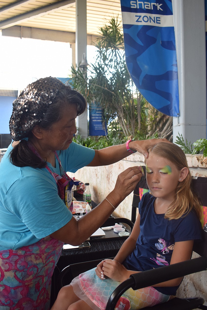 Akiko Graphics provided face painting for all children at Mote's World Ocean Day event.