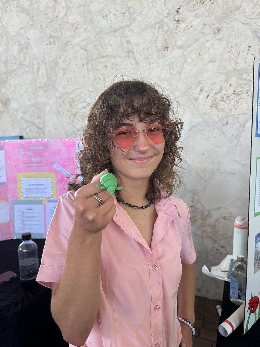 Isabelle Gunderson made 3D prints of manatees to give to the people she talked at the World Ocean Day event.